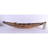 A LARGE EARLY 20TH CENTURY NORTH AMERICAN PAINTED WOOD TRIBAL CANOE. 88 cm x 25 cm.