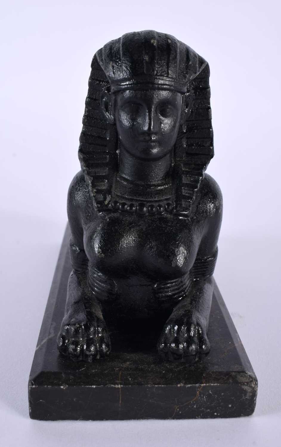 A 19TH CENTURY GRAND TOUR BLACK PAINTED METAL AND MARBLE MODEL OF A SPHINX After the Antiquity. 18 - Image 2 of 5