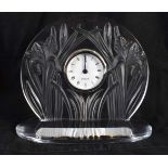 A FRENCH LALIQUE GLASS IRIS FLOWER CLOCK decorated with scrolling organic foliage. 18 cm x 18 cm.