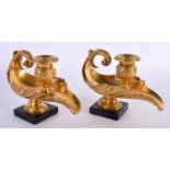 A PAIR OF EARLY 19TH CENTURY ENGLISH REGENCY ORMOLU OIL LAMPS modelled in the classical Romanesque