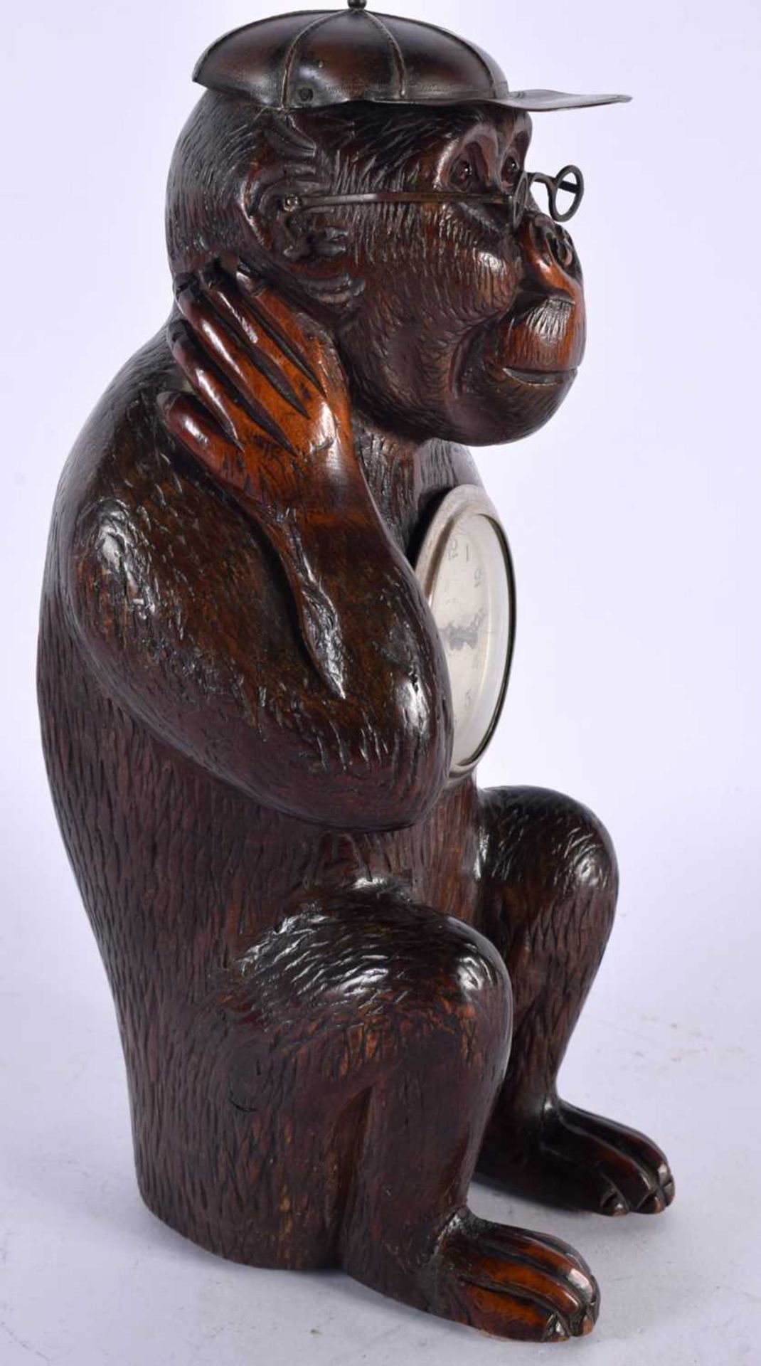 AN UNUSUAL LATE 19TH CENTURY BAVARIAN BLACK FOREST CARVED LINDEN WOOD CLOCK formed as a seated - Image 2 of 4