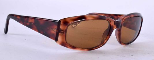 A PAIR OF RAYBAN RITUALS SUNGLASSES.