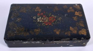 A SMALL ANTIQUE TOLEWARE RECTANGULAR BOX painted with flowers and vines. 11 cm x 7 cm.