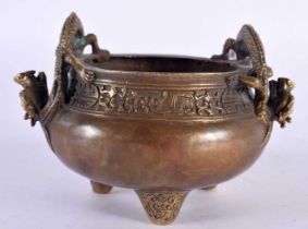 A CHINESE QING DYNASTY TWIN HANDLED BRONZE CENSER bearing Kangxi marks to base, with stylised dragon