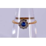 A LATE VICTORIAN/EDWARDIAN 18CT GOLD DIAMOND AND SAPPHIRE CLUSTER RING of delicate proportions. L.