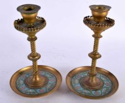 A PAIR OF 19TH CENTURY FRENCH BRONZE AND CHAMPLEVE ENAMEL CANDLESTICKS with spiral formed central