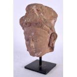 A 7th/8th Century Pink Sandstone Head of a Female Deity, Madhya Pradesh, Central India mounted on