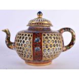 A 17TH/18TH CENTURY CHINESE EXPORT CLOBBERED IMARI RETICULATED TEAPOT AND COVER Kangxi/Yongzheng,