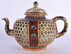 A 17TH/18TH CENTURY CHINESE EXPORT CLOBBERED IMARI RETICULATED TEAPOT AND COVER Kangxi/Yongzheng,