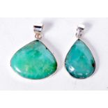 TWO GREEN STONE SILVER PENDANTS. 15.7 grams. 3.5 cm x 3 cm. (2)