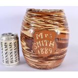 AN UNUSUAL 19TH CENTURY ENGLISH TREACLE GLAZED BISCUIT BARREL entitled Mrs Smith 1889. 21 cm x