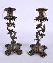 A PAIR OF 19TH CENTURY EUROPEAN BRONZE CANDLESTICKS formed with entwined vines and foliage. 25 cm