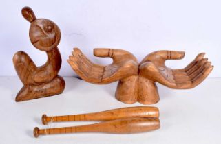 A large wood carving of hands together with another carving and a pair of vintage exercise pins 17 x