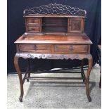 A 19th Century Chinese hardwood two drawer desk with top shelf section and carved frieze gallery 121