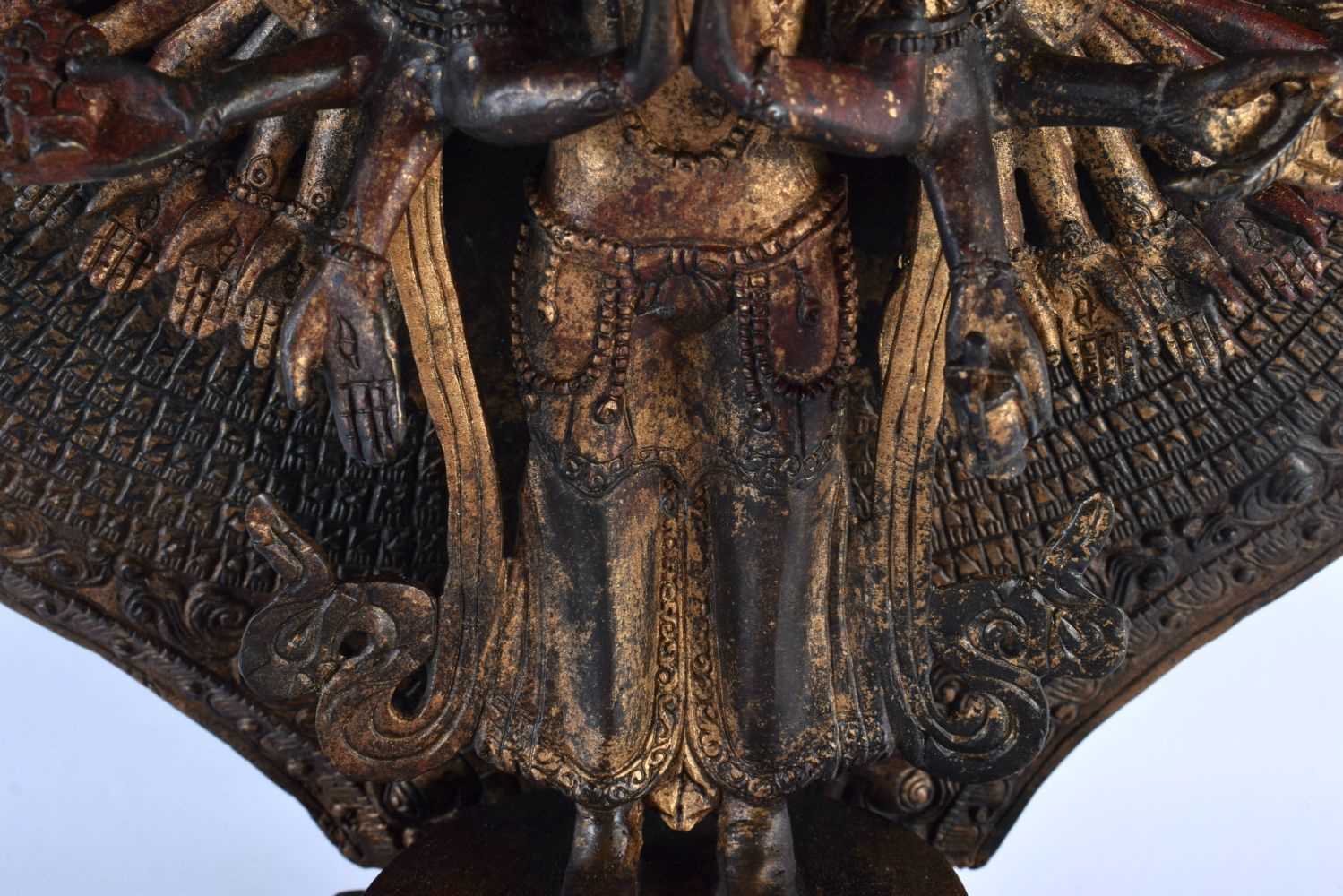 A LARGE CHINESE LACQUERED SINO TIBETAN BRONZE FIGURE OF A BUDDHA modelled with multiple arms. 46 - Image 5 of 10