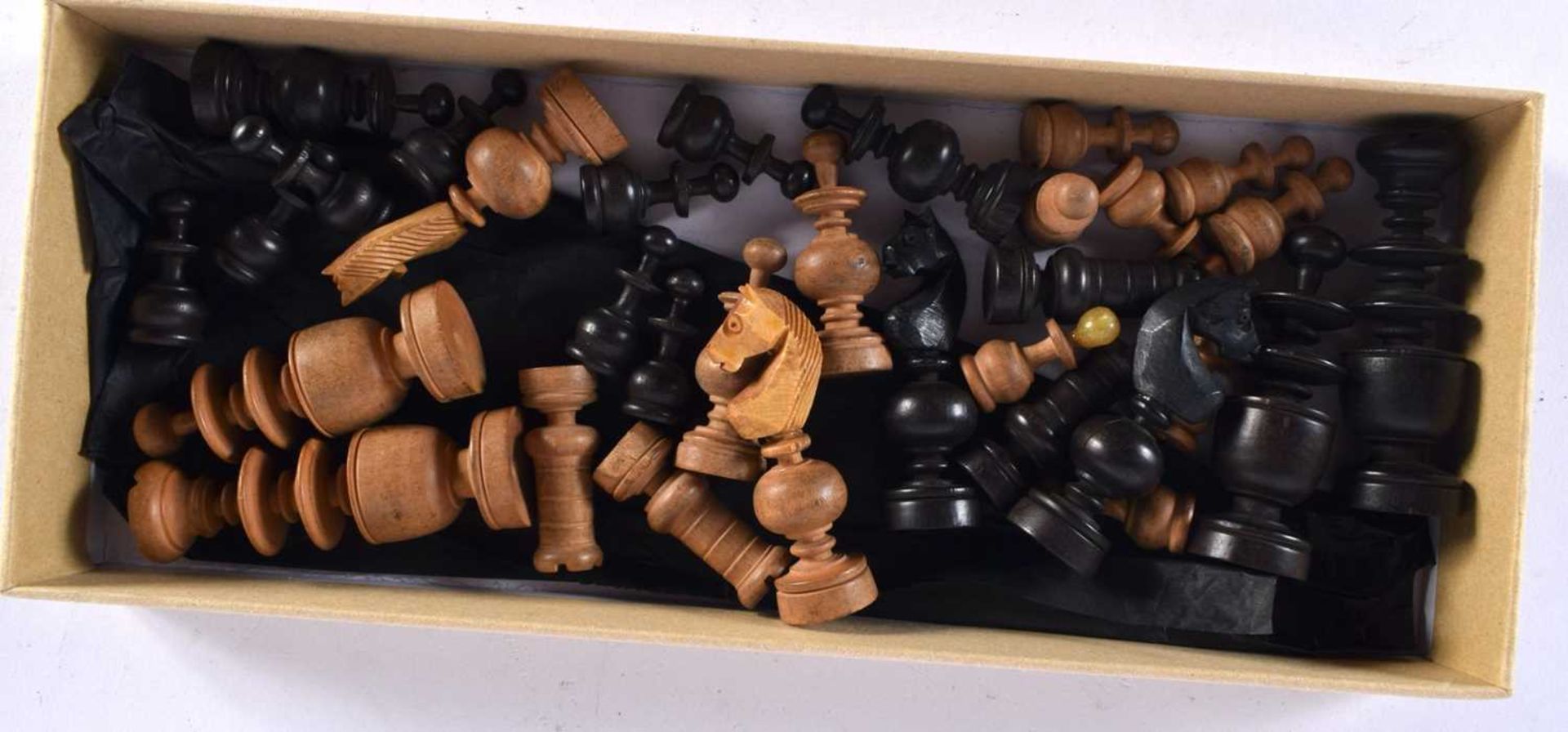 A VINTAGE CARVED WOOD CHESS SET. Largest 6 cm high. (qty)