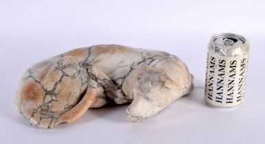 AN EARLY EUROPEAN CARVED ALABASTER FIGURE OF A RECLINING HOUND possibly 17th/18th century. 30cm x