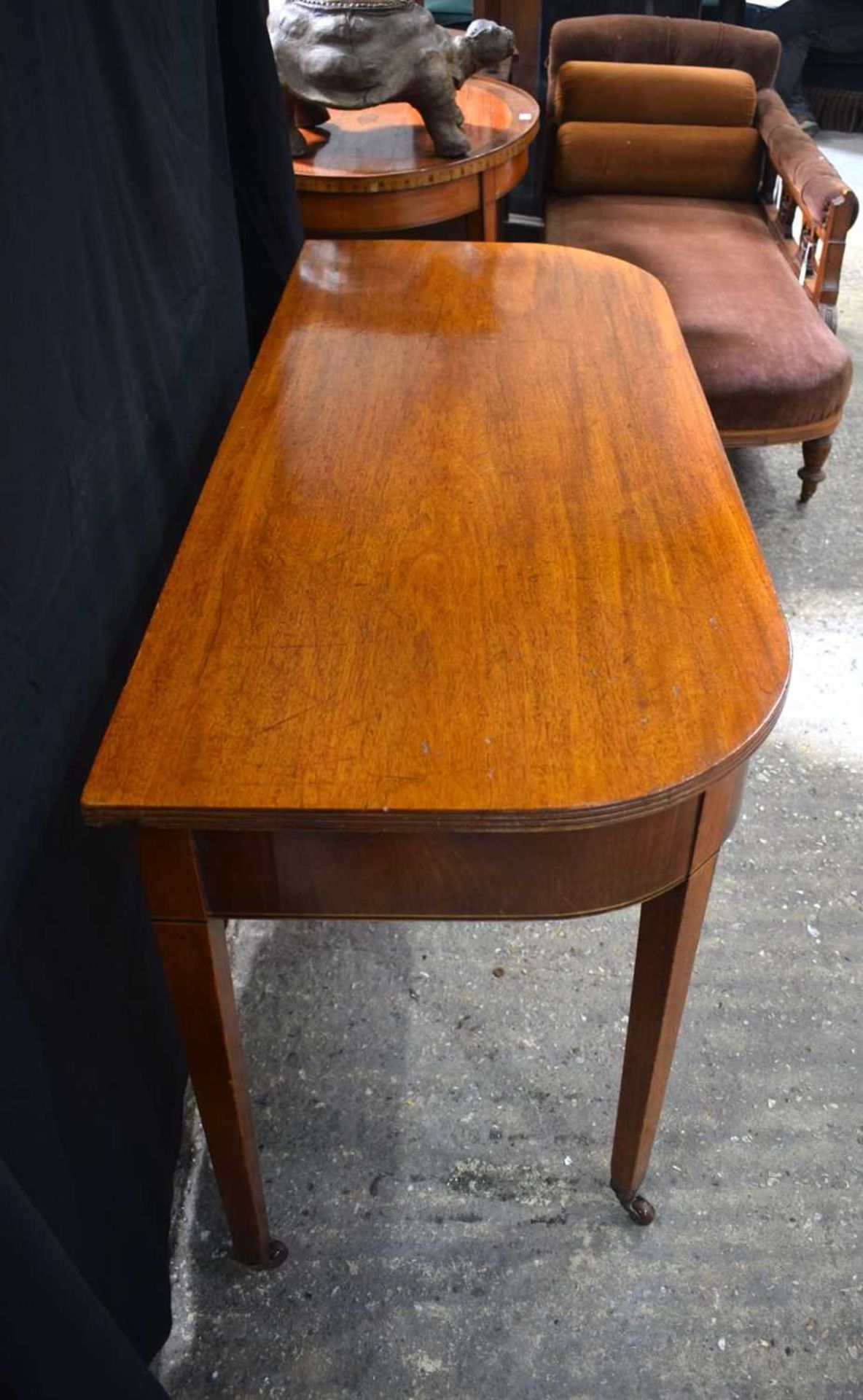 A 19th Century Bow fronted mahogany top side table with castored legs 75 x 124 x 53 cm. - Image 3 of 4