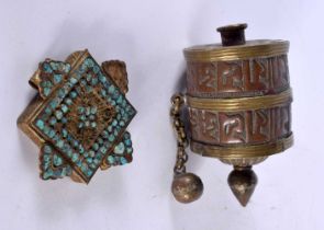 AN ANTIQUE TIBETAN PRAYER WHEEL together with a similar plaque. 151 grams. Largest 10.75 cm x 6