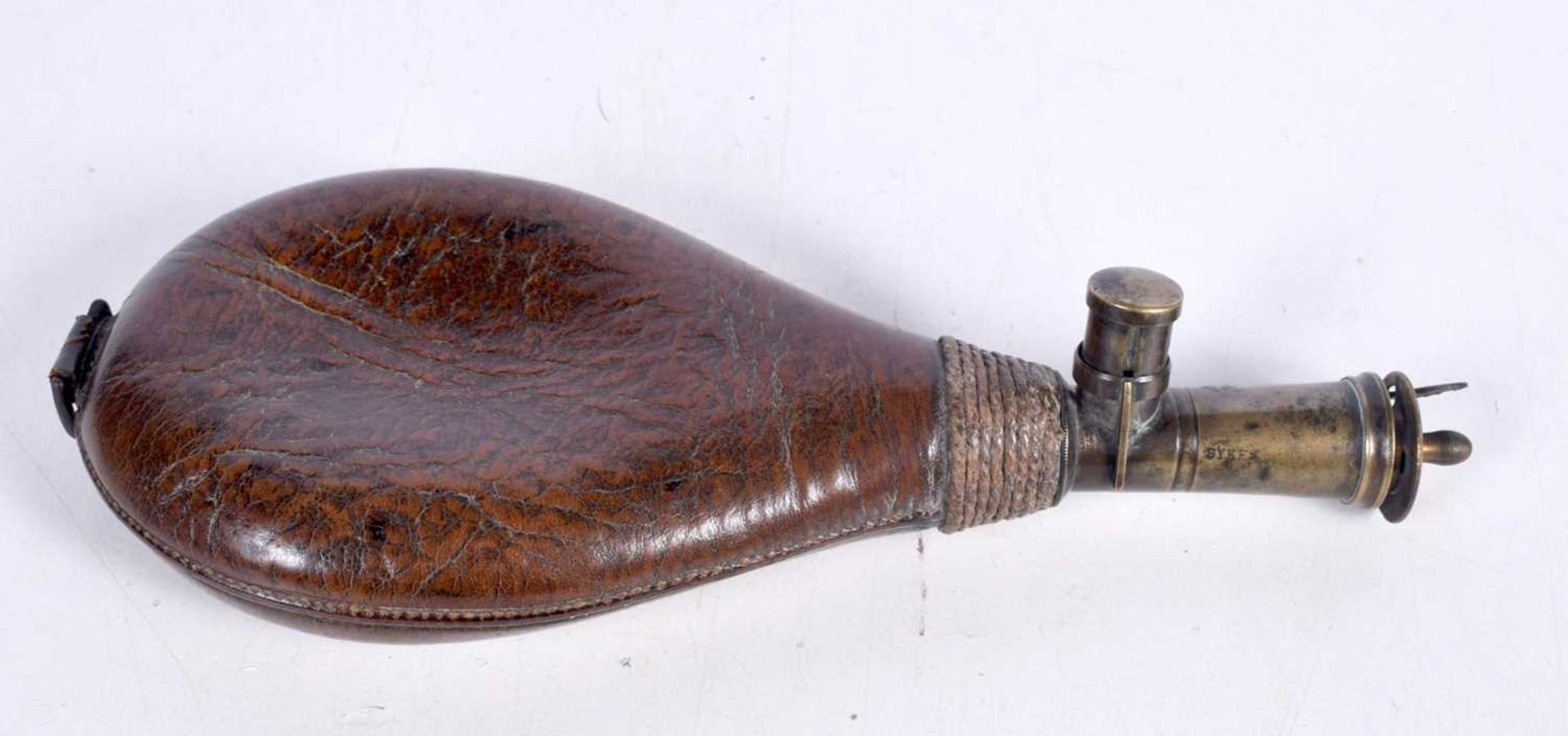 A 19th Century leather and brass powder flask 22cm.