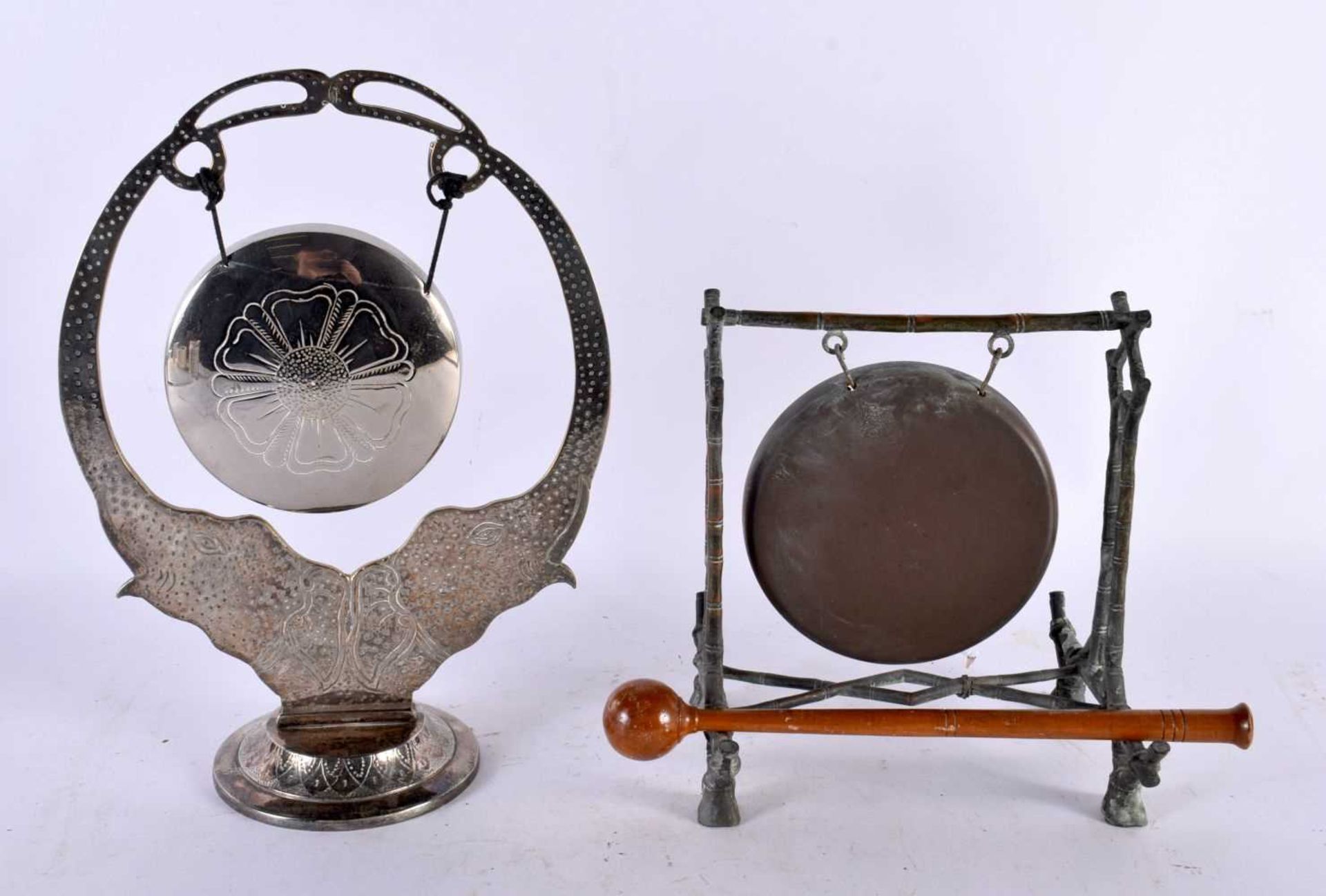 AN AESTHETIC MOVEMENT BRONZE TABLE GONG together with an Indian white white elephant gong. Largest