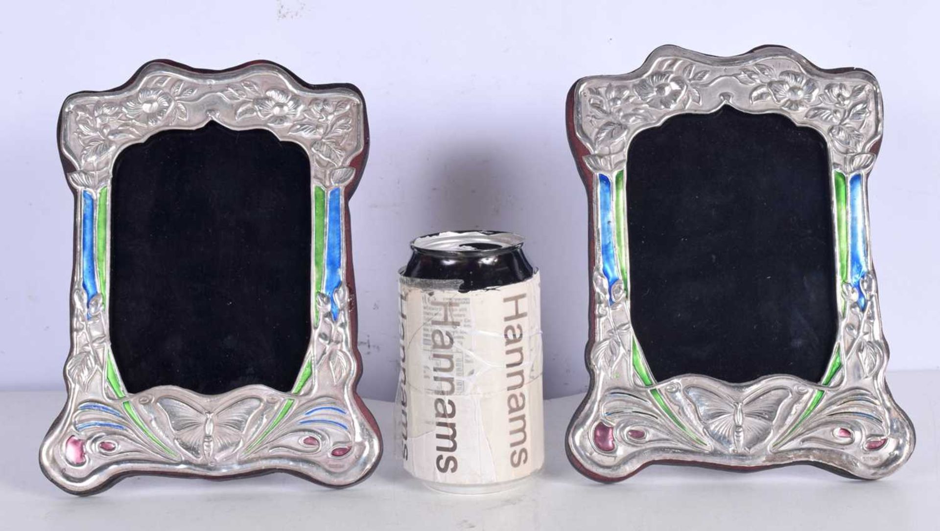 A pair of silver and enamelled picture frames 20 x 15cm.