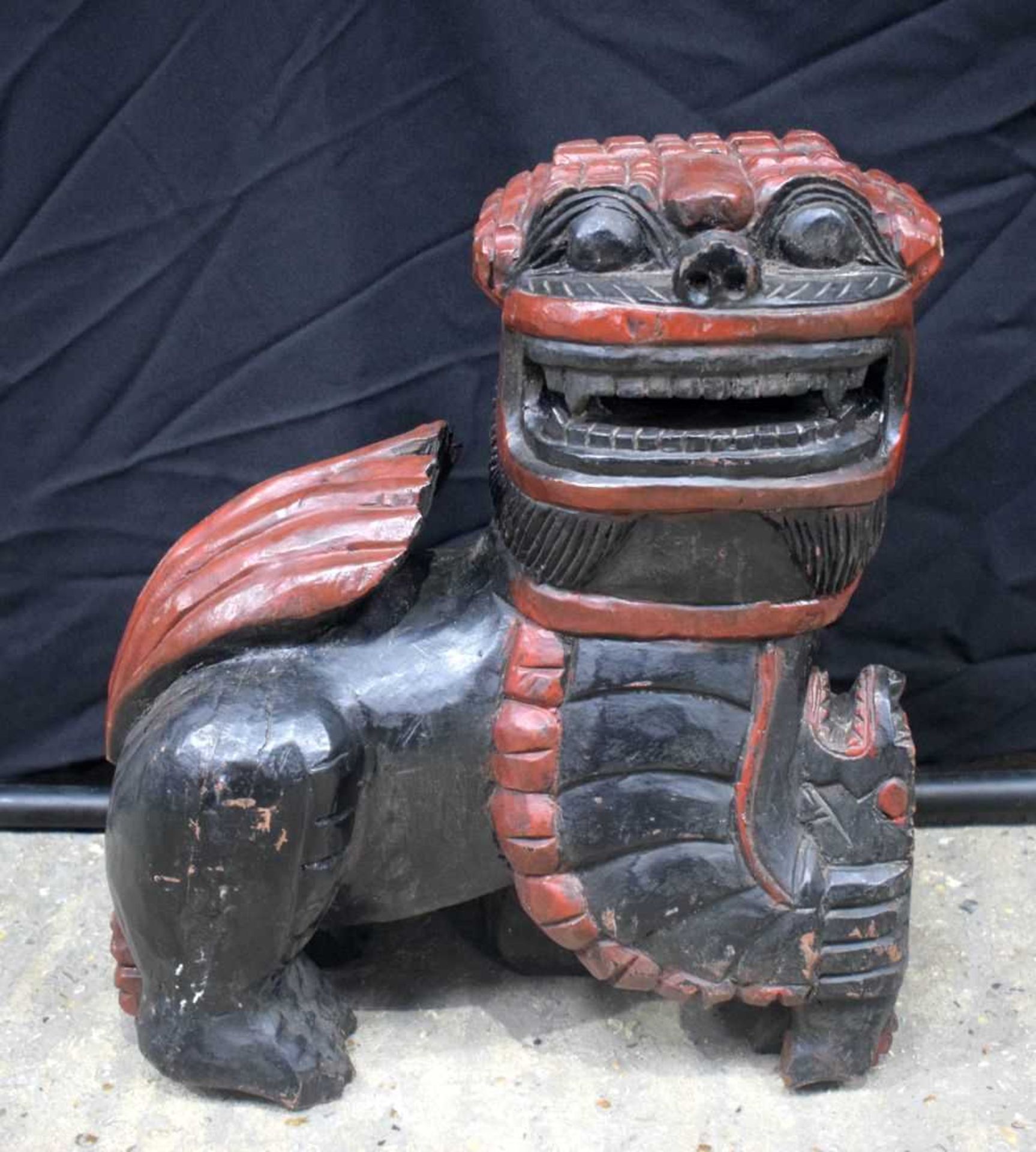 A large carved wood polychrome Temple dog 54 x 50 cm