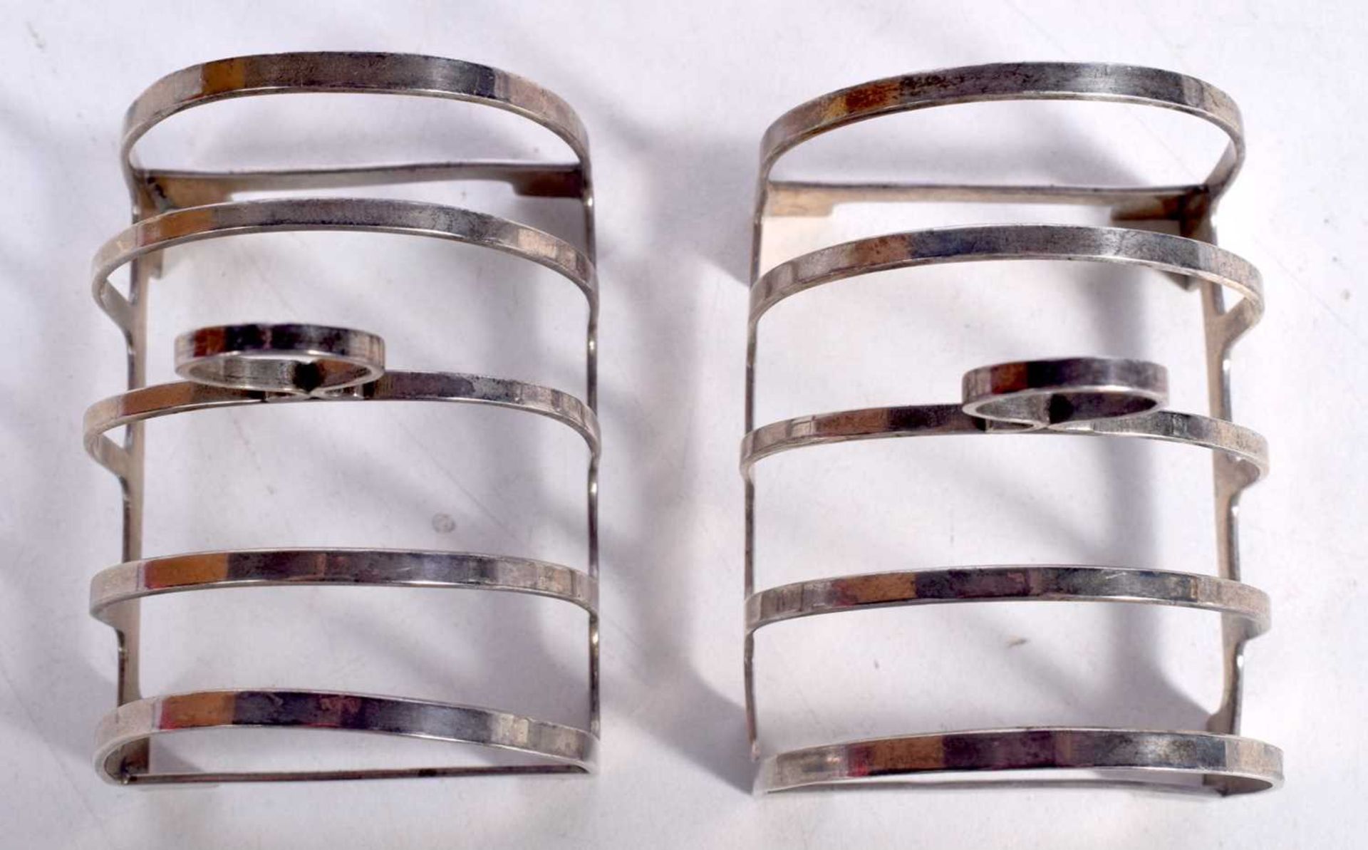 A PAIR OF ART DECO SILVER TOAST RACKS. Birmingham 1935. 85 grams. 7.5 cm x 6.75 cm. - Image 2 of 4