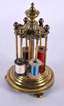 A 19TH CENTURY ENGLISH BRONZE COUNTRY HOUSE BOBBIN HOLDER modelled with an acanthus top. 18cm high.