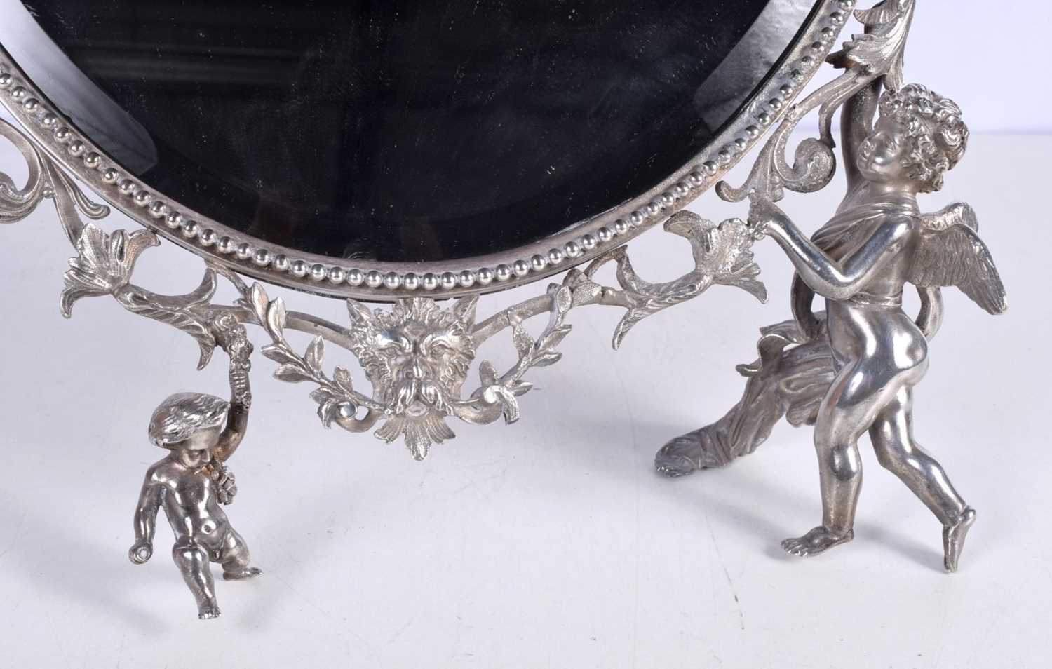 A large dressing table bevelled mirror plated metal with scrolling surround with Cherub supports - Image 3 of 5