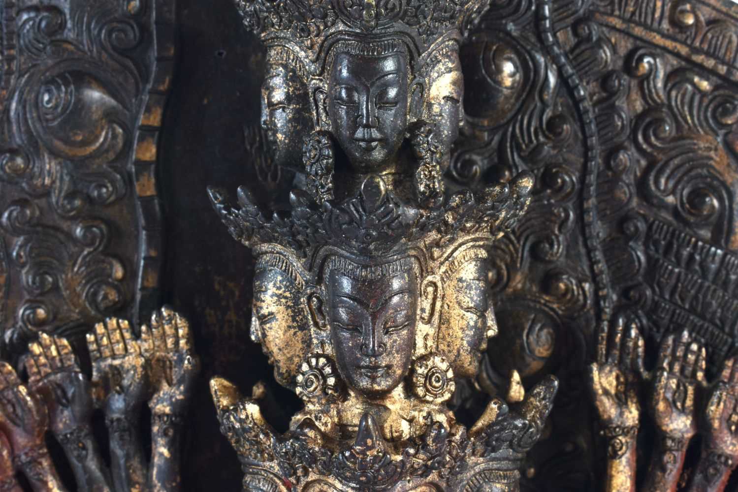 A LARGE CHINESE LACQUERED SINO TIBETAN BRONZE FIGURE OF A BUDDHA modelled with multiple arms. 46 - Image 3 of 10