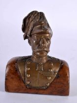 A LATE 19TH CENTURY GRAND TOUR BRONZE BUST OF A MILITARY MALE modelled upon an oak plinth. 12 cm x 8