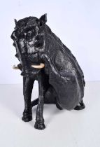 A late 20th century carved hardwood sculpture of a South African Warthog signed R Mponda on a foot