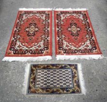 A pair of small Boukhara rugs together with a prayer mat largest 108 x 60 cm. (3).