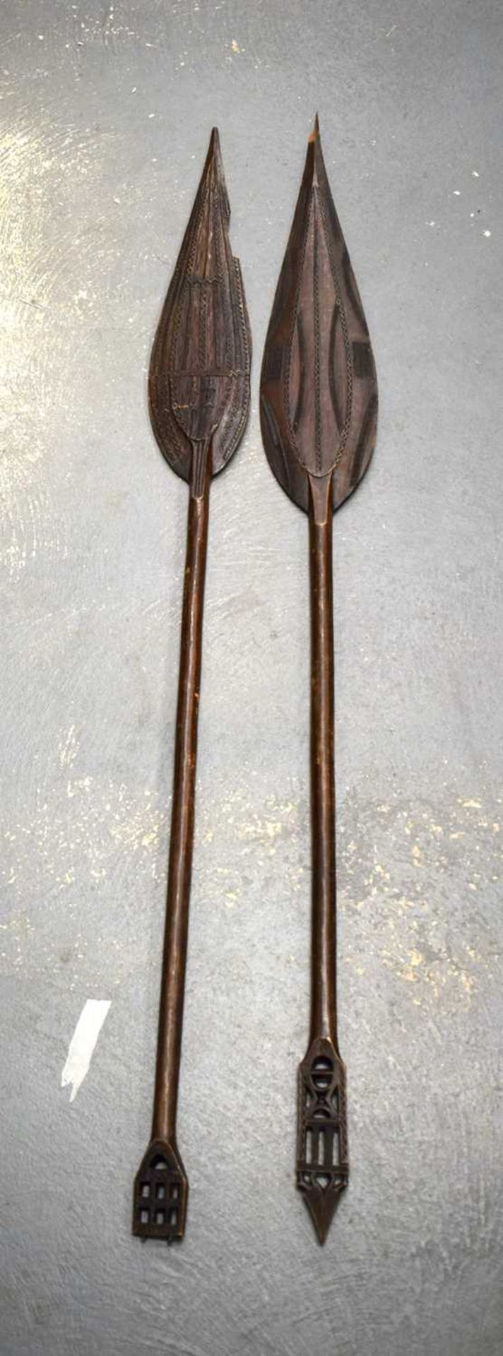 TWO AFRICAN TRIBAL CARVED WOOD PADDLES one decorated with animals, the other with motifs. 160 cm