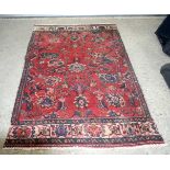 An Oriental rug 199 x 117 cm.