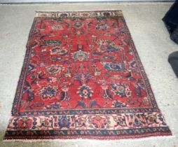 An Oriental rug 199 x 117 cm.