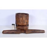 A large late 19th / early 20th century Tribal carved hardwood Pestle and Mortar. 77 X 8.5cm.