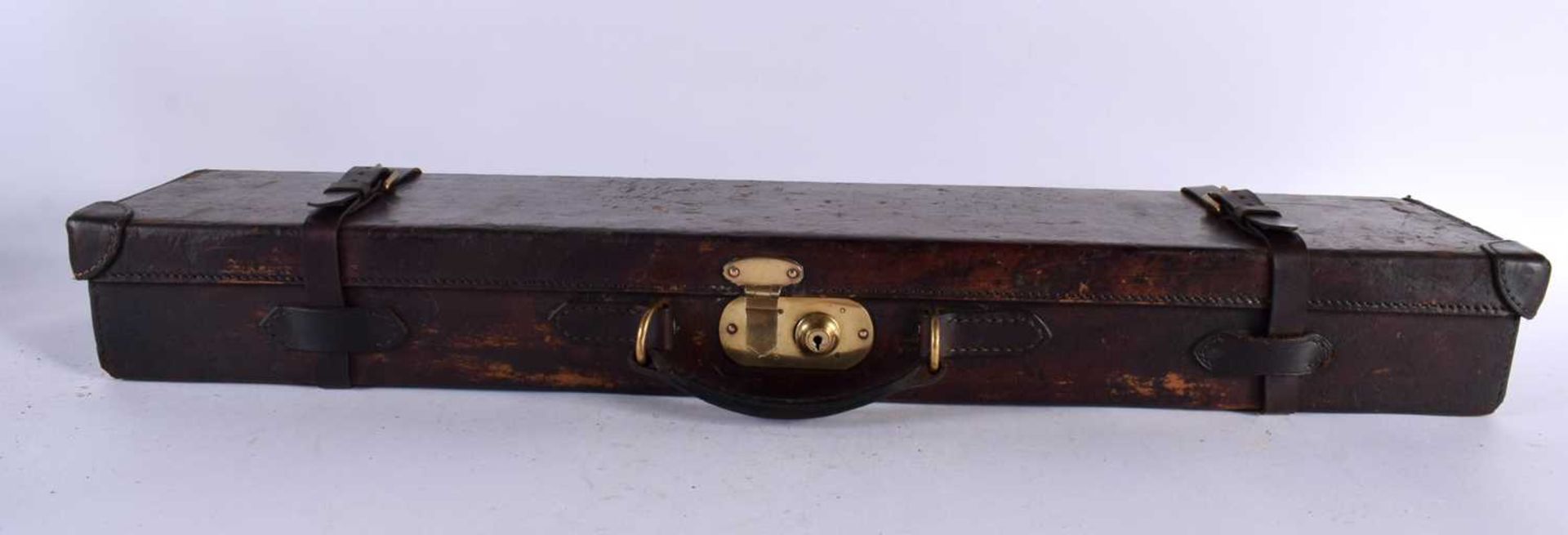 A VINTAGE LEATHER GUN CASE. 85 cm x 20cm.