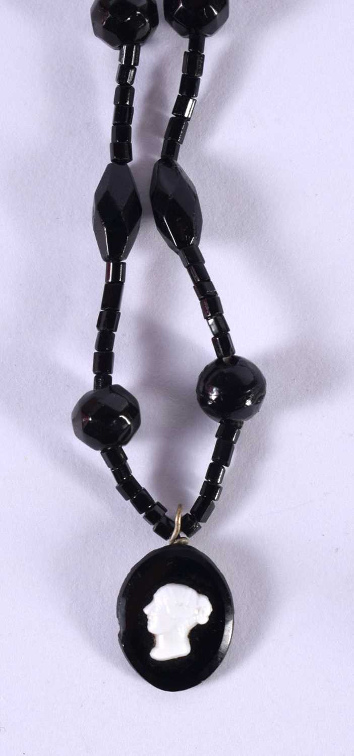 TWO JET NECKLACES AND A PAIR OF JET EARRINGS. Longest 132cm, total weight 58g (3) - Image 3 of 3