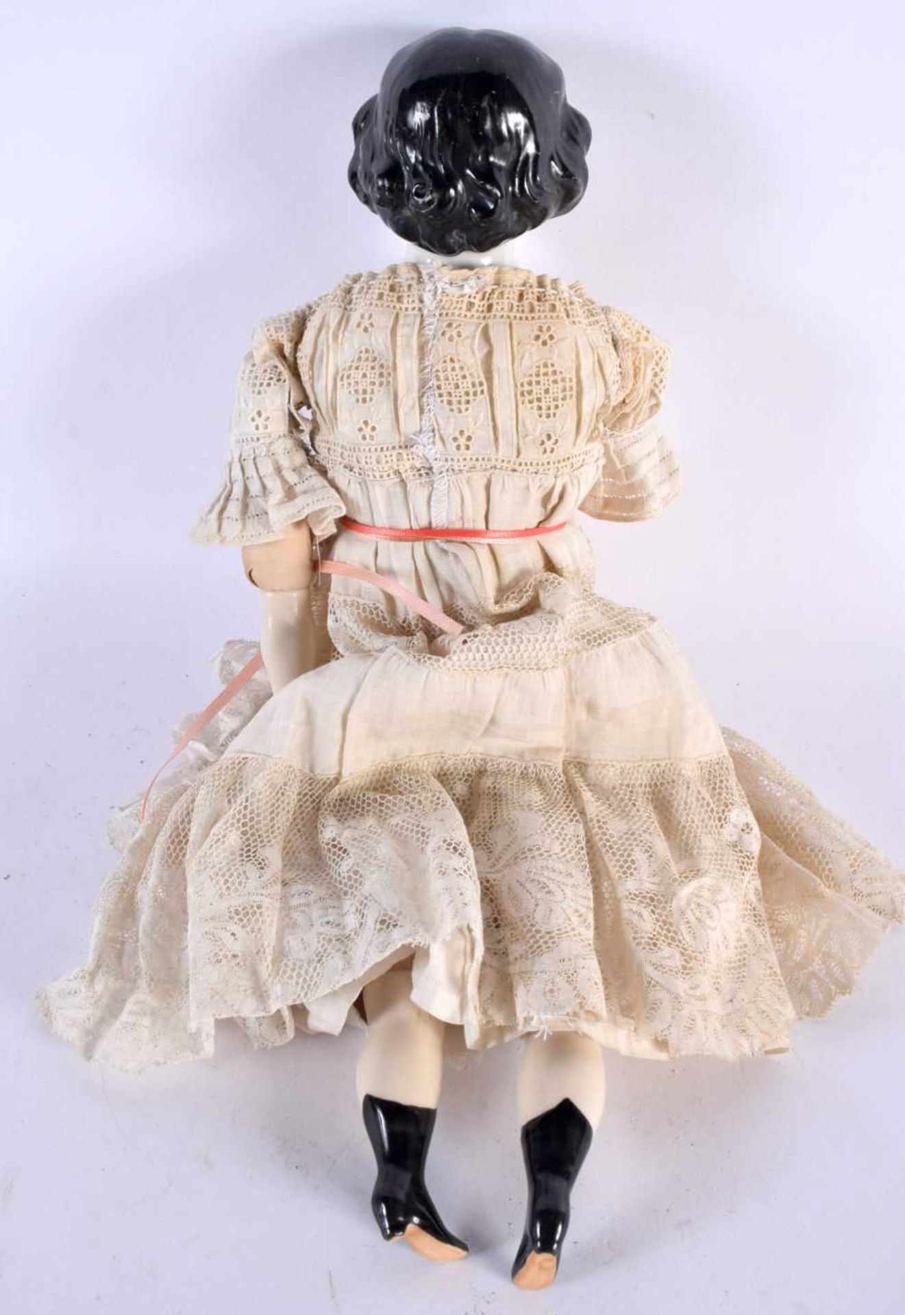 AN ANTIQUE PORCELAIN HEADED DOLL with lace outfit. 38 cm long. - Image 3 of 3