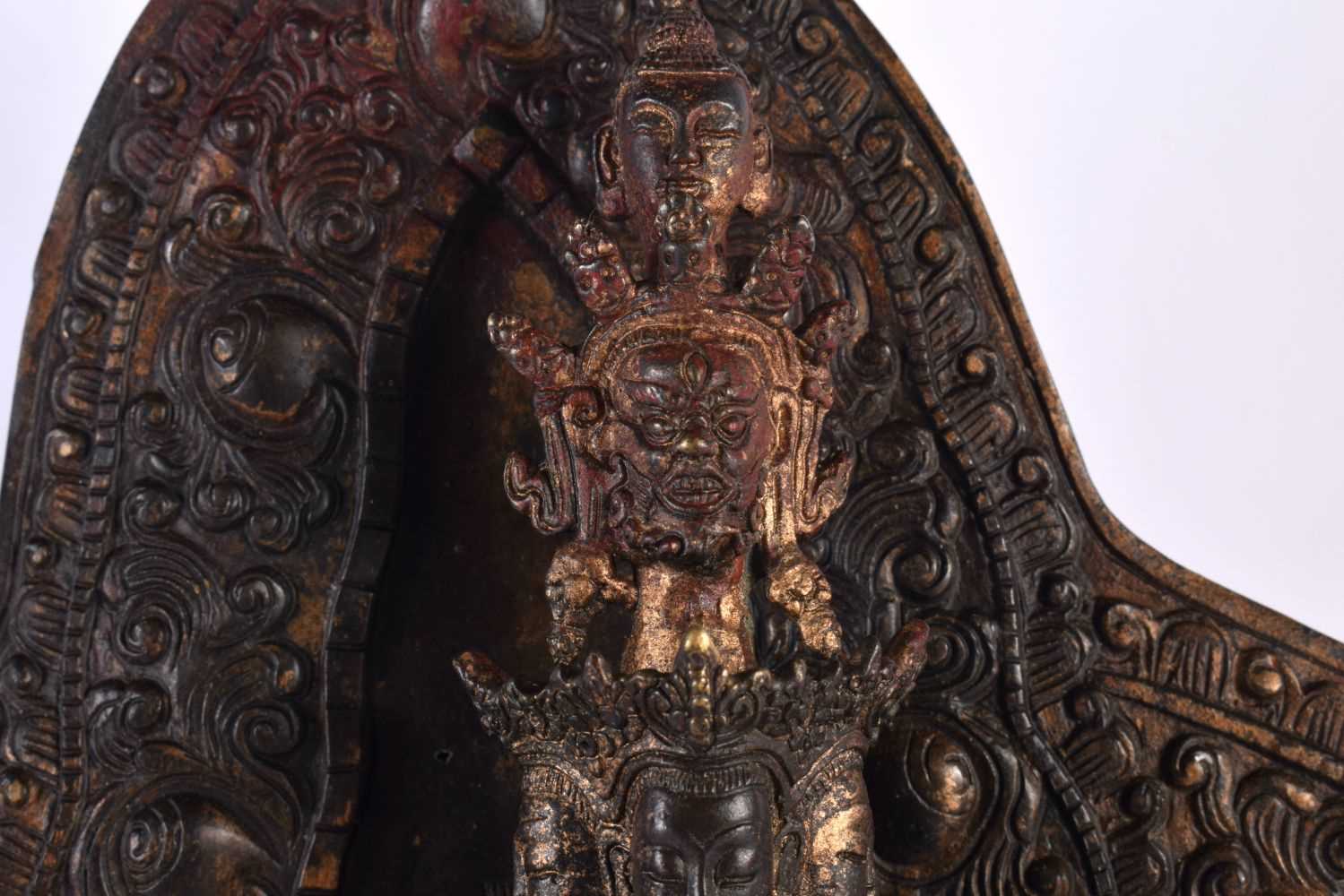 A LARGE CHINESE LACQUERED SINO TIBETAN BRONZE FIGURE OF A BUDDHA modelled with multiple arms. 46 - Image 2 of 10