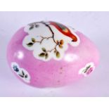 A 19TH CENTURY CONTINENTAL PORCELAIN PINK GROUND EGG painted with birds perched amongst