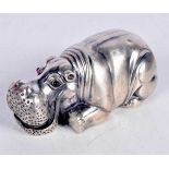 A CONTINENTAL SILVER MODEL OF A HIPPO WITH RED GEM SET EYES. Stamped 88, 7.9cm x 3.4cm x 3.7cm,