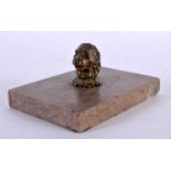 AN 18TH CENTURY ENGLISH BRONZE AND MARBLE DESK STAND PAPERWEIGHT formed as a lion mask head. 13 cm x