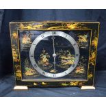 A Chinoiserie mantel clock by Smiths 23 x 27 cm.