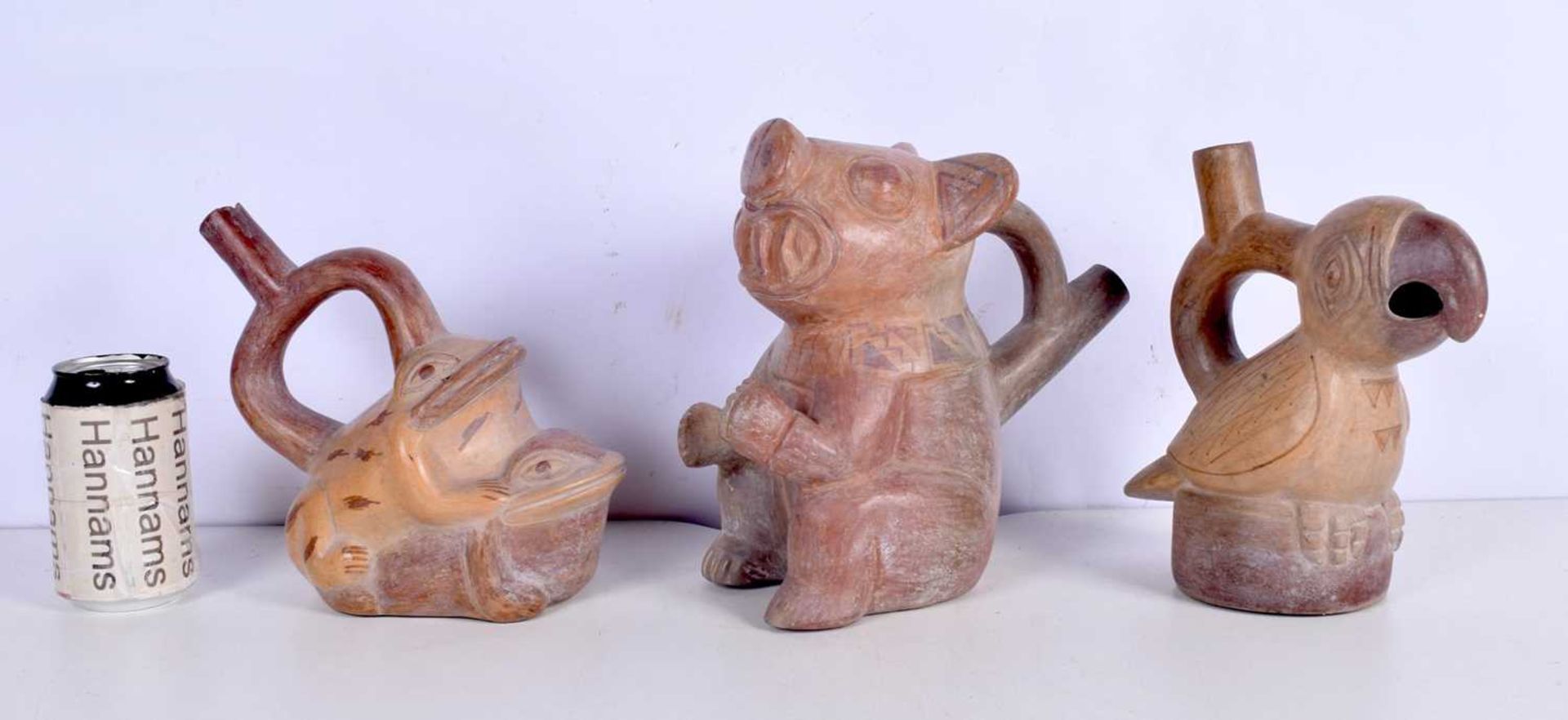 A collection of Peruvian Terracotta Moche culture style items 23 cm.(3)