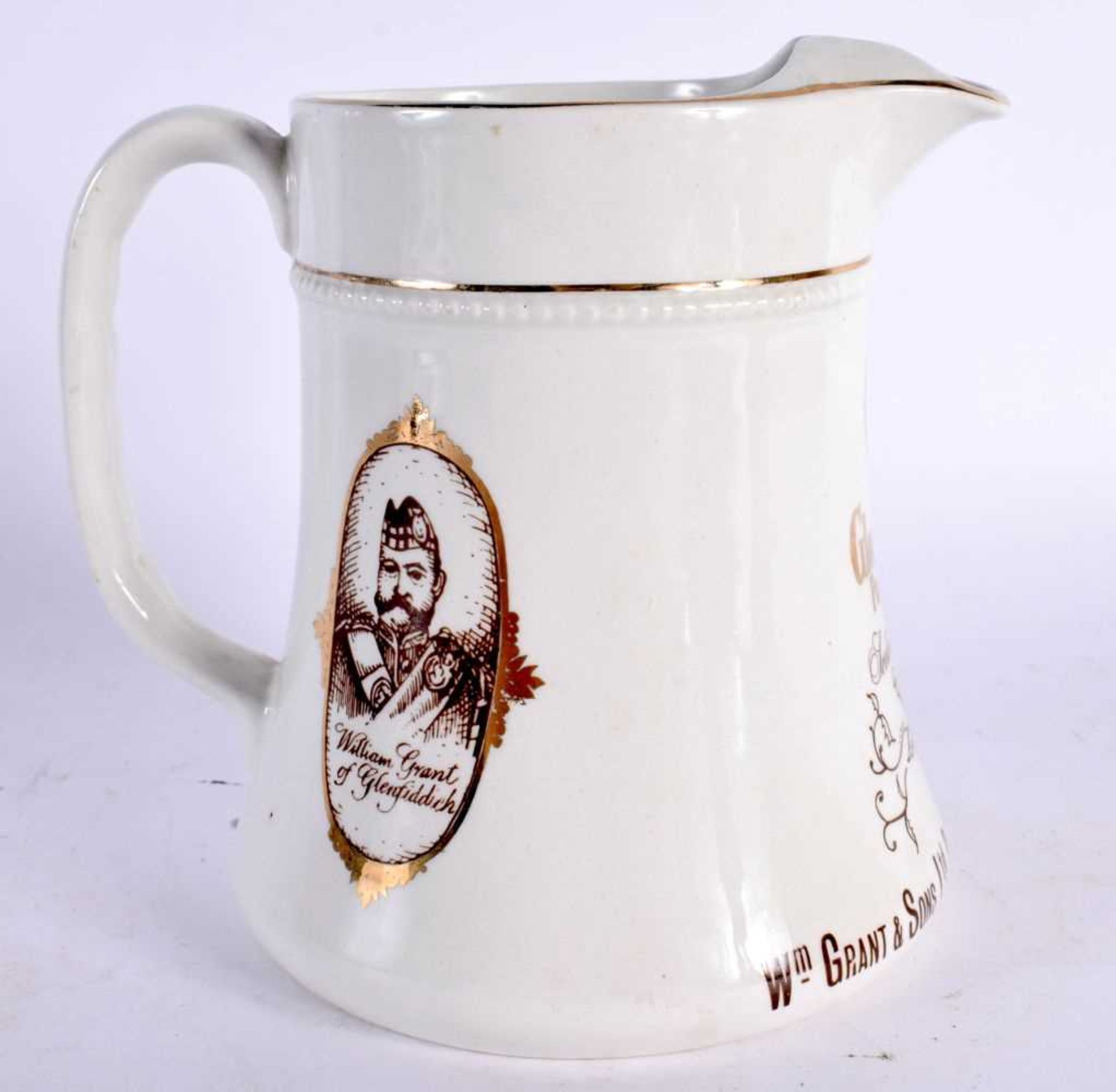 A GLENFIDDICH PURE MALT SCOTCH WHISKY ADVERTISING JUG. 14.5 cm high.