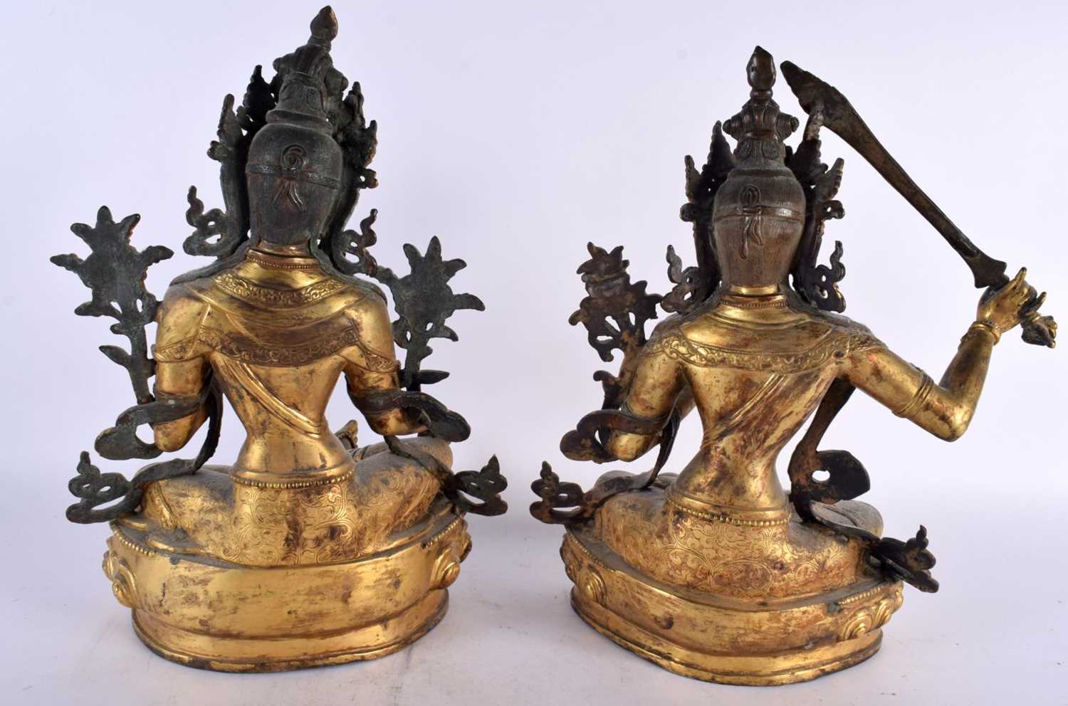 A LARGE PAIR OF 19TH CENTURY CHINESE TIBETAN GILT BRONZE FIGURES OF BUDDHAS Qing, modelled upon - Image 7 of 9