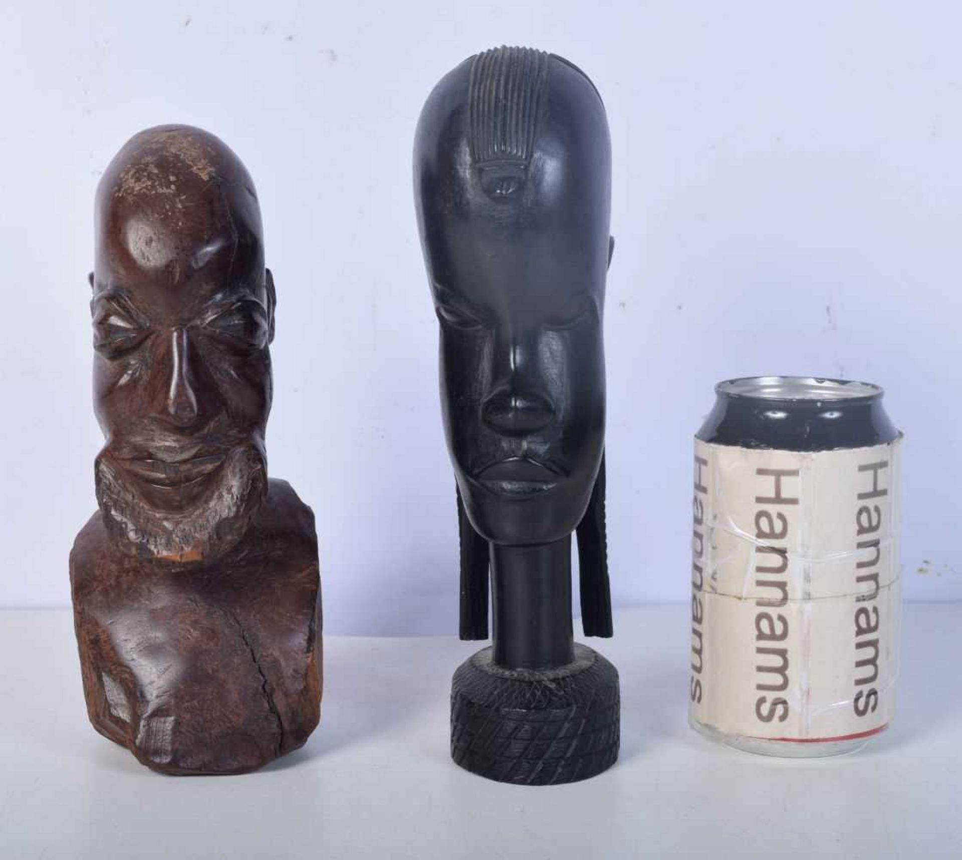 A carved Ebony African tribal bust together with another carved figure 22cm (2).